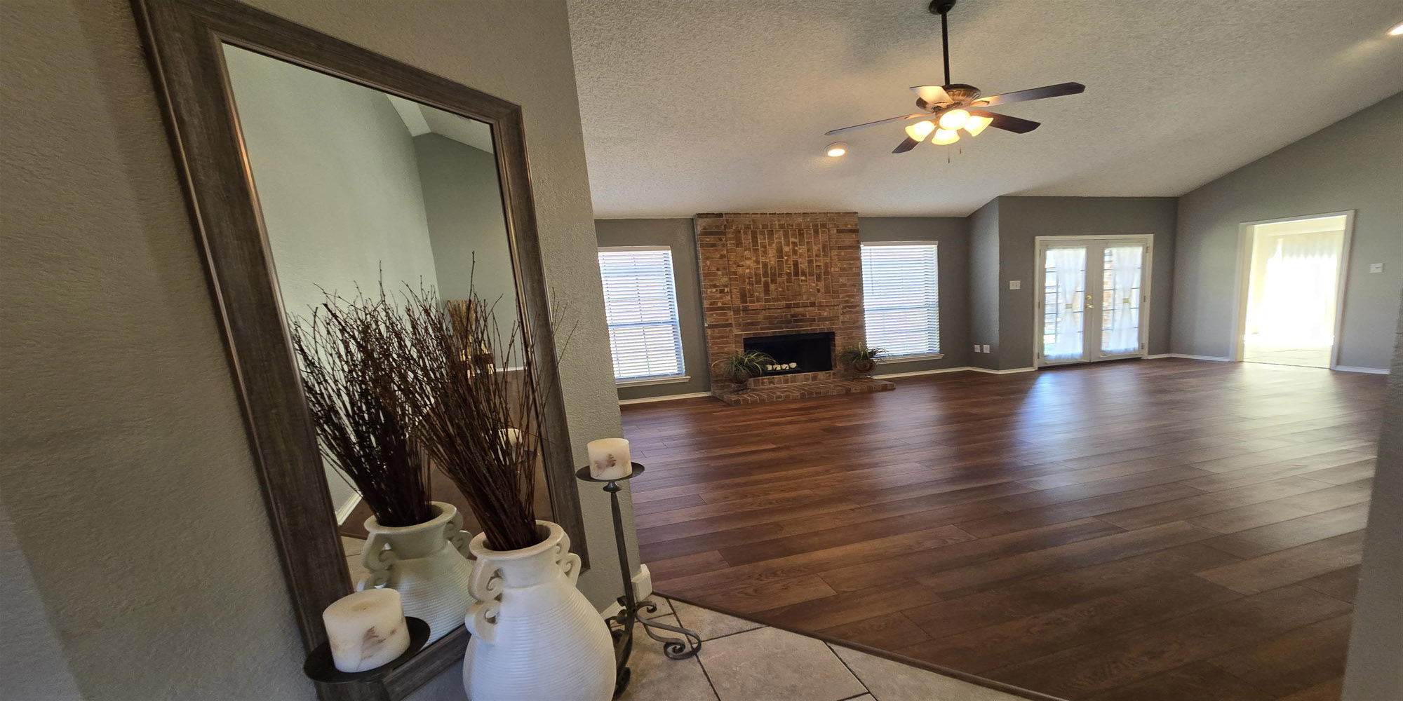 Living Room Fireplace with French Doors to Back Yard